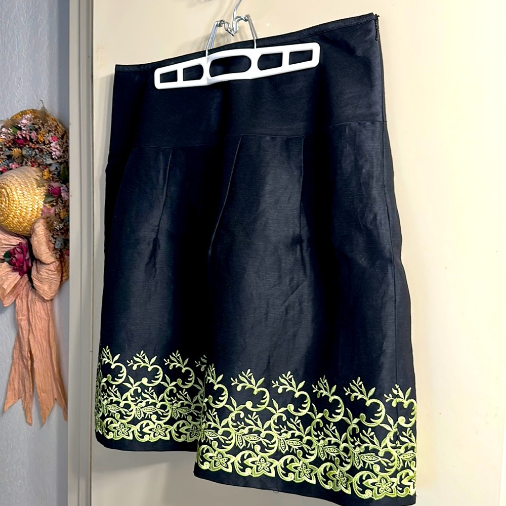 Caslon fully lined skirt with green floral hemlines. Worn once, like new